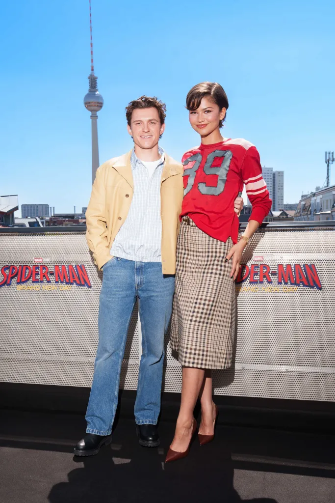 Zendaya and Tom Holland posing together at the 