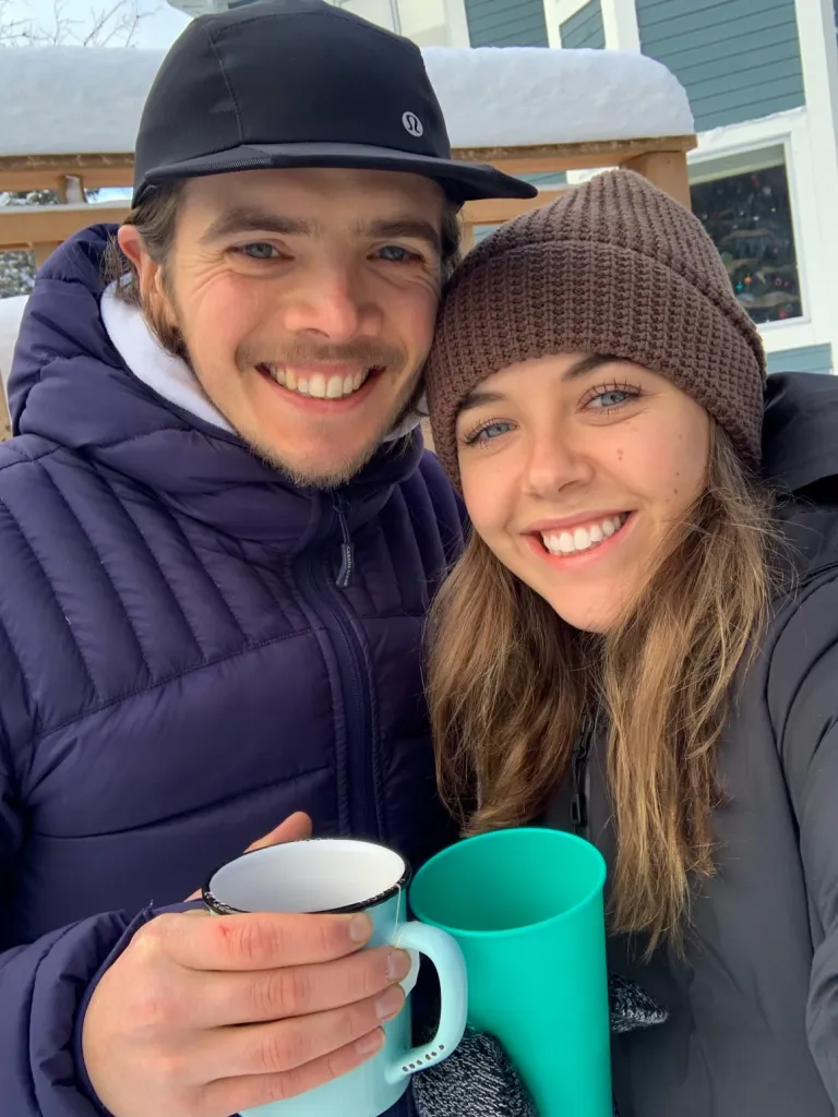 Laura Murphy and late fiancé Devon O'Grady smiling and holding mugs.