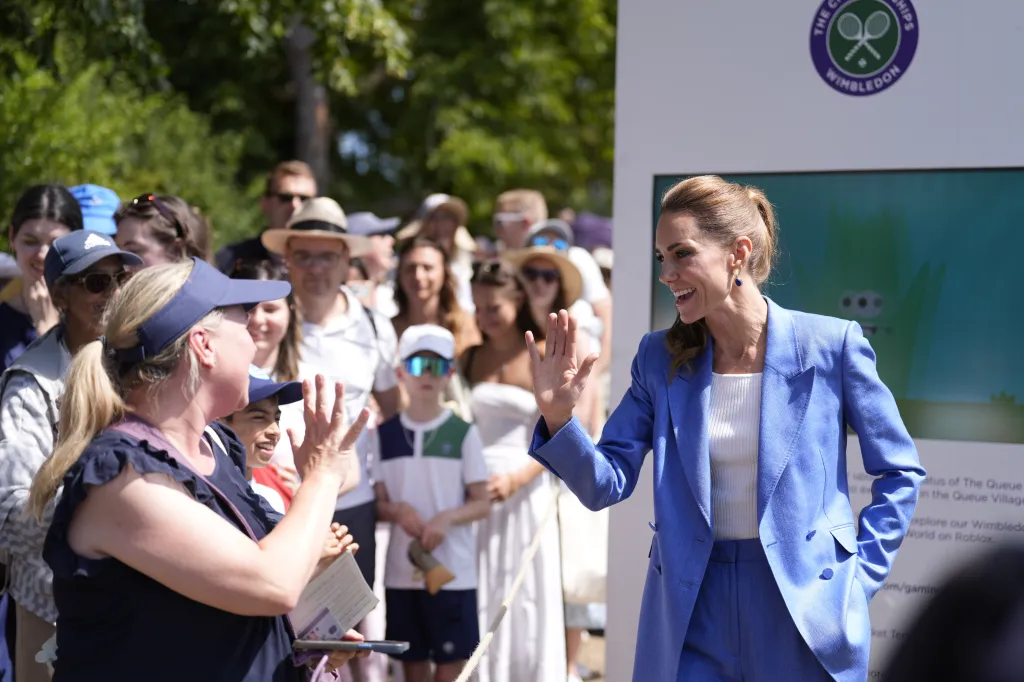 Britain's Kate, the Princess of Wales, waving to a person at the Wimbledon Tennis Championships.