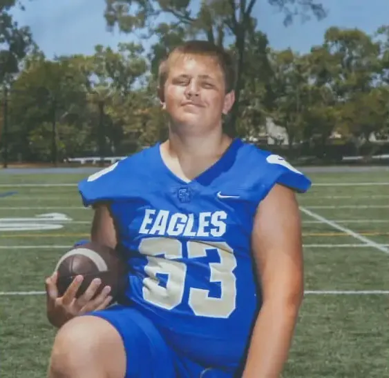 Brody Matteson in a blue football uniform with