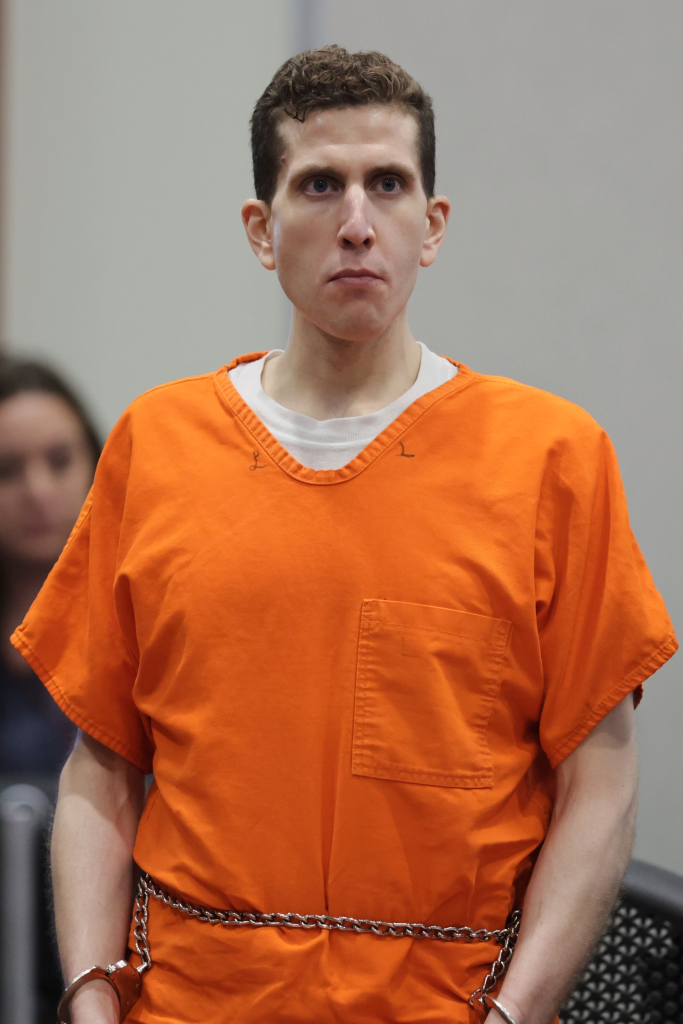 Bryan Kohberger in an orange jumpsuit, shackles, and handcuffs at his sentencing hearing.