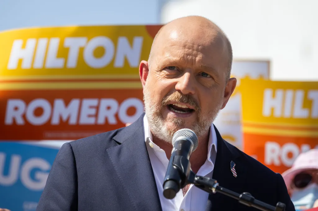 California Republican gubernatorial candidate Steve Hilton speaks into a microphone.
