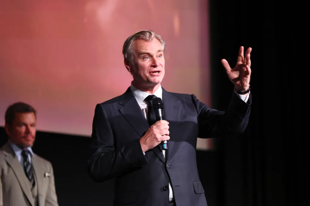 Christopher Nolan speaking onstage at 