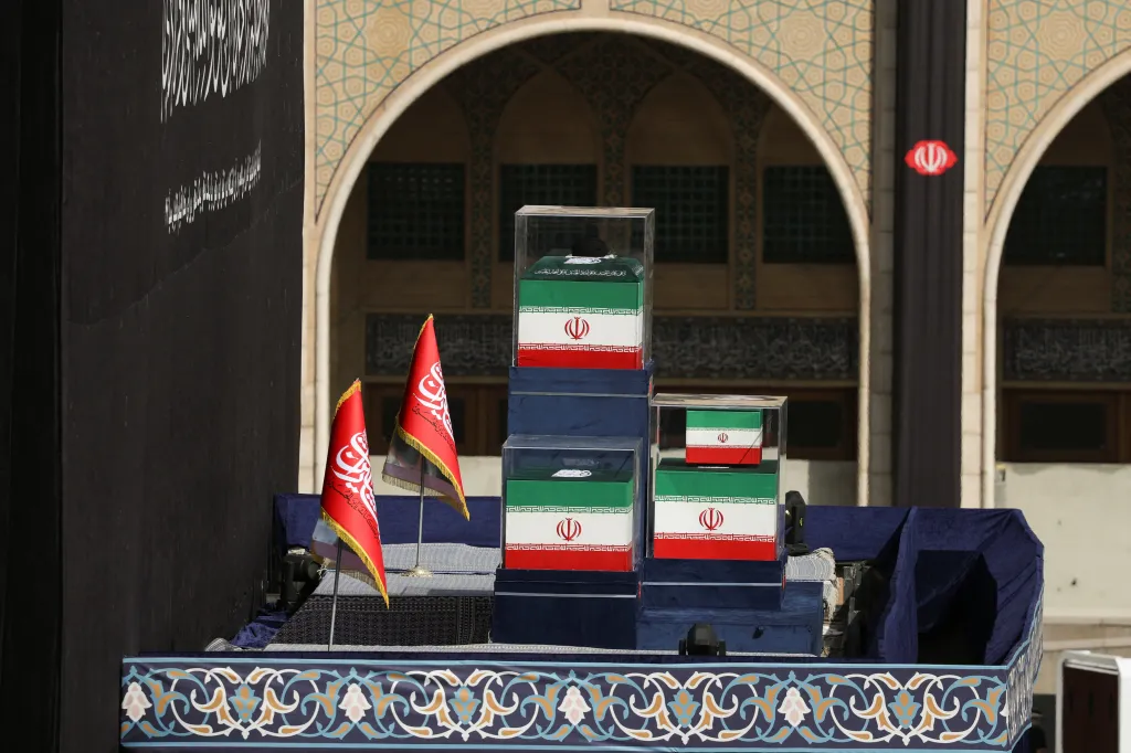 Coffins of Iran's late Supreme Leader Ayatollah Ali Khamenei and his family members are displayed in glass boxes during a public farewell ceremony at the Imam Khomeini Grand Mosalla, in Tehran, Iran, on July 4, 2026. 