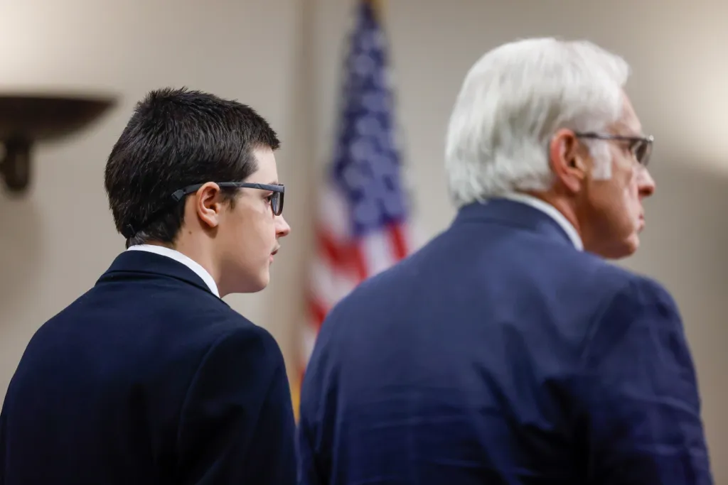 Colt Gray, a 16-year-old high school shooting suspect, stands next to his attorney Charlton Allen at Barrow County Superior Court.
