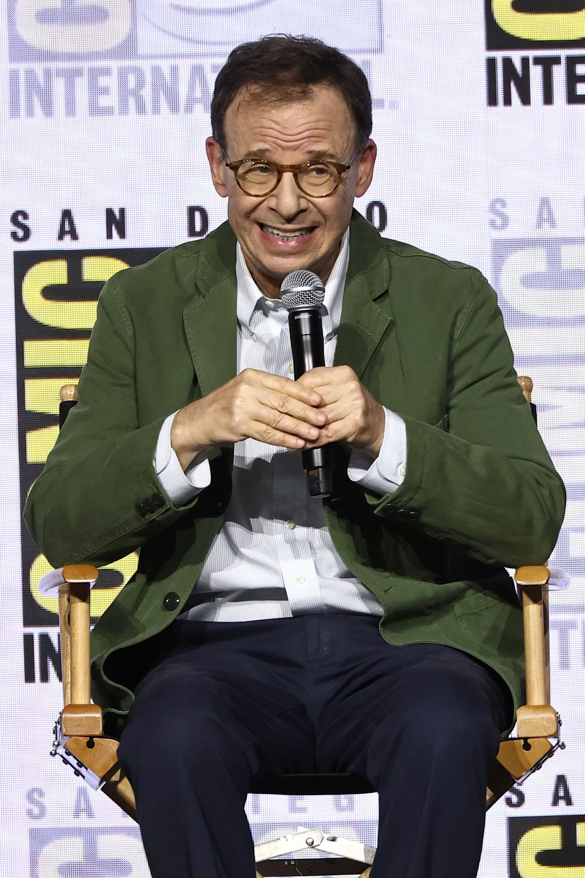 Rick Moranis speaking at a Comic-Con panel.