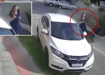 Terrifying video shows woman narrowly escape death as speeding truck plows into SUV next to her