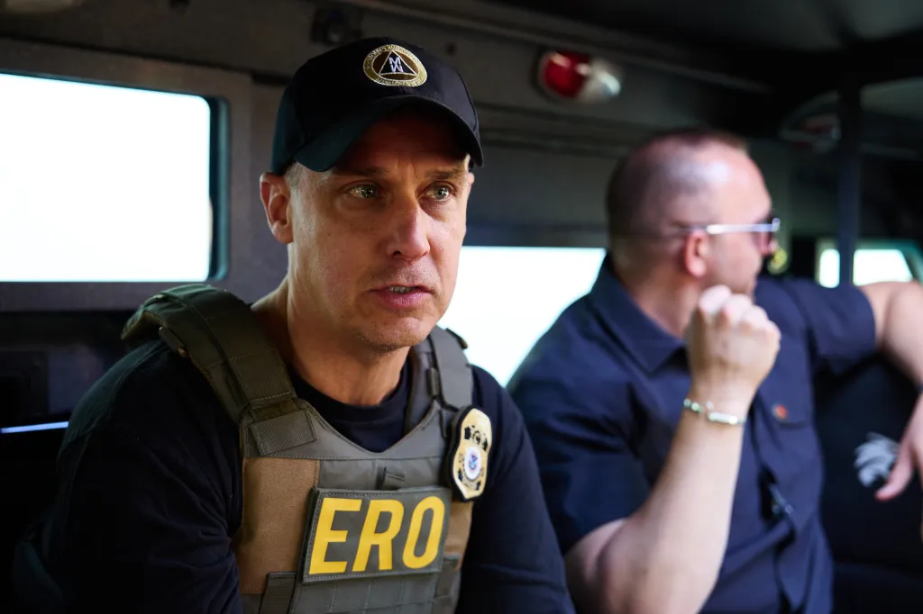 An agent wearing a tactical vest with