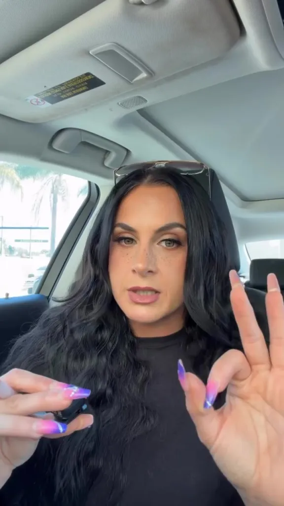 Jennifer Hyatt Tedmori in a car, discussing a residual check.