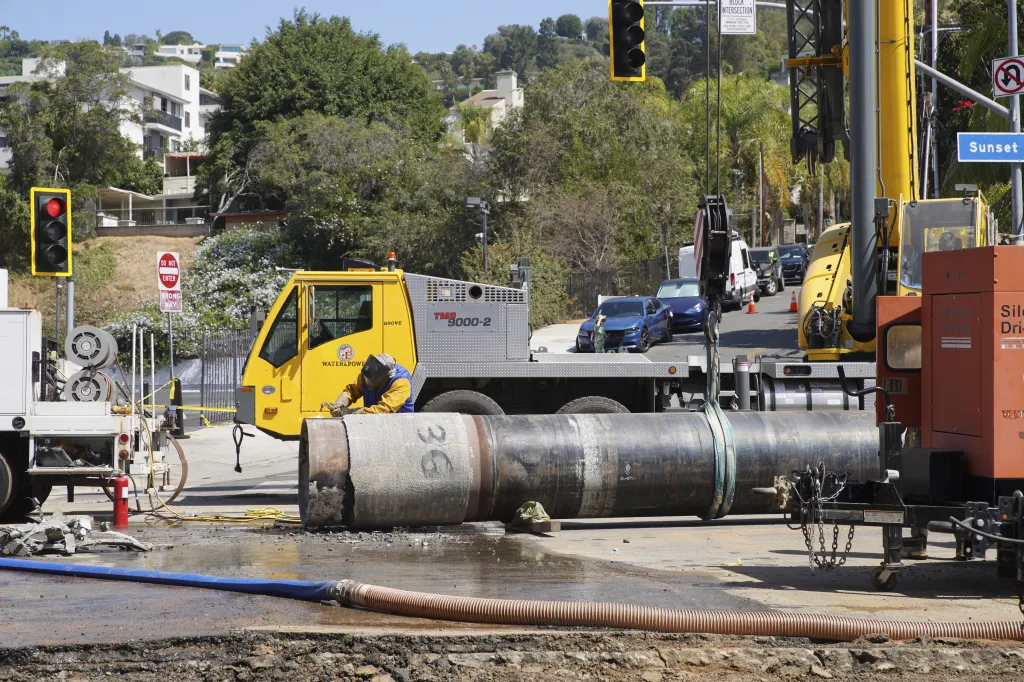 Crews repairing a sinkhole and pipes after a water main break in West Hollywood.