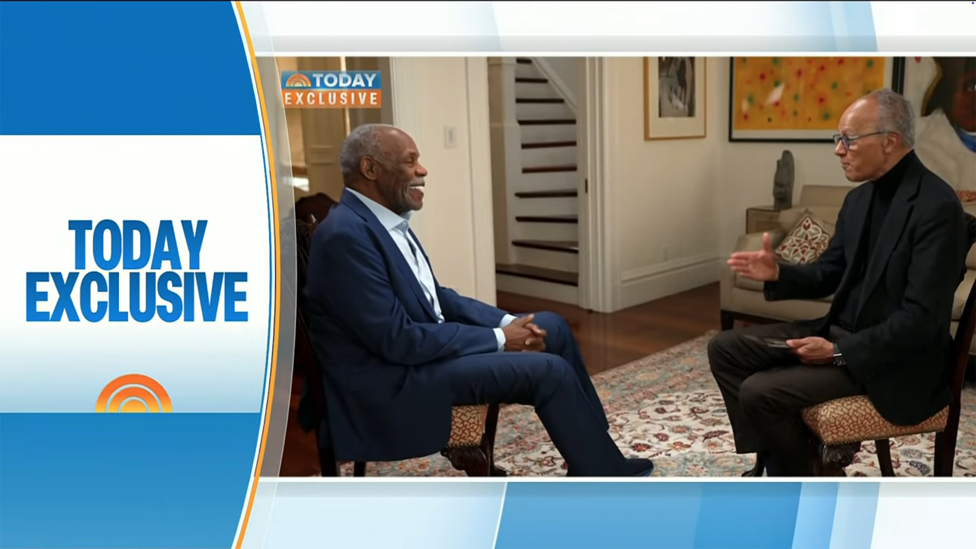 Danny Glover being interviewed by an unknown man for 