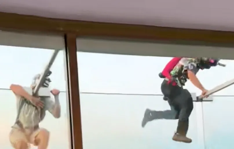 Two BASE jumpers illegally jumping from the Space Needle.
