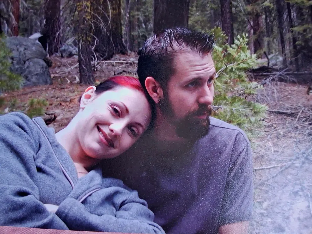 David and Bernadette Vander Meer in a wooded area.