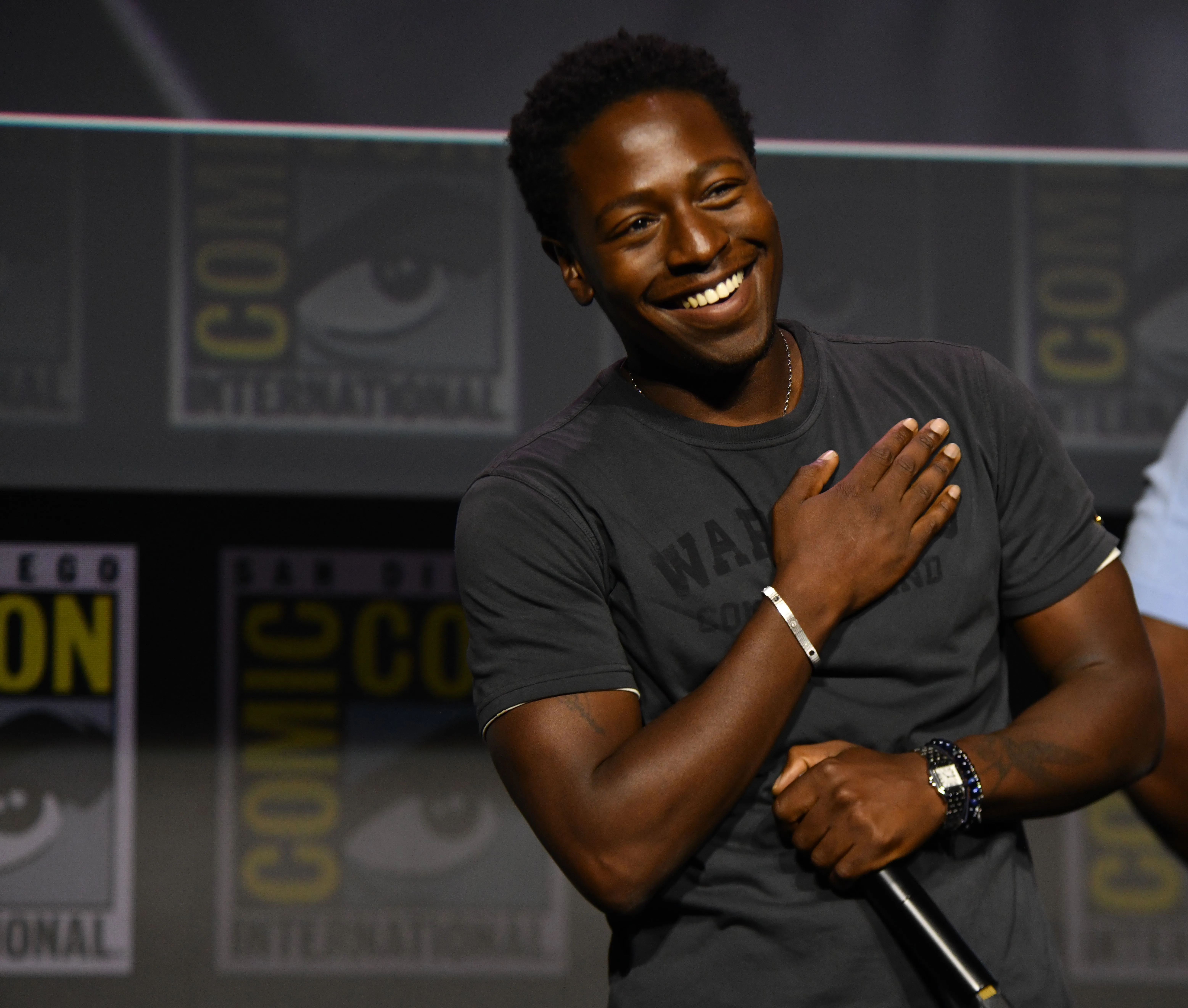 David Jonsson smiles at the 'Black Panther III' presentation at Comic-Con International.