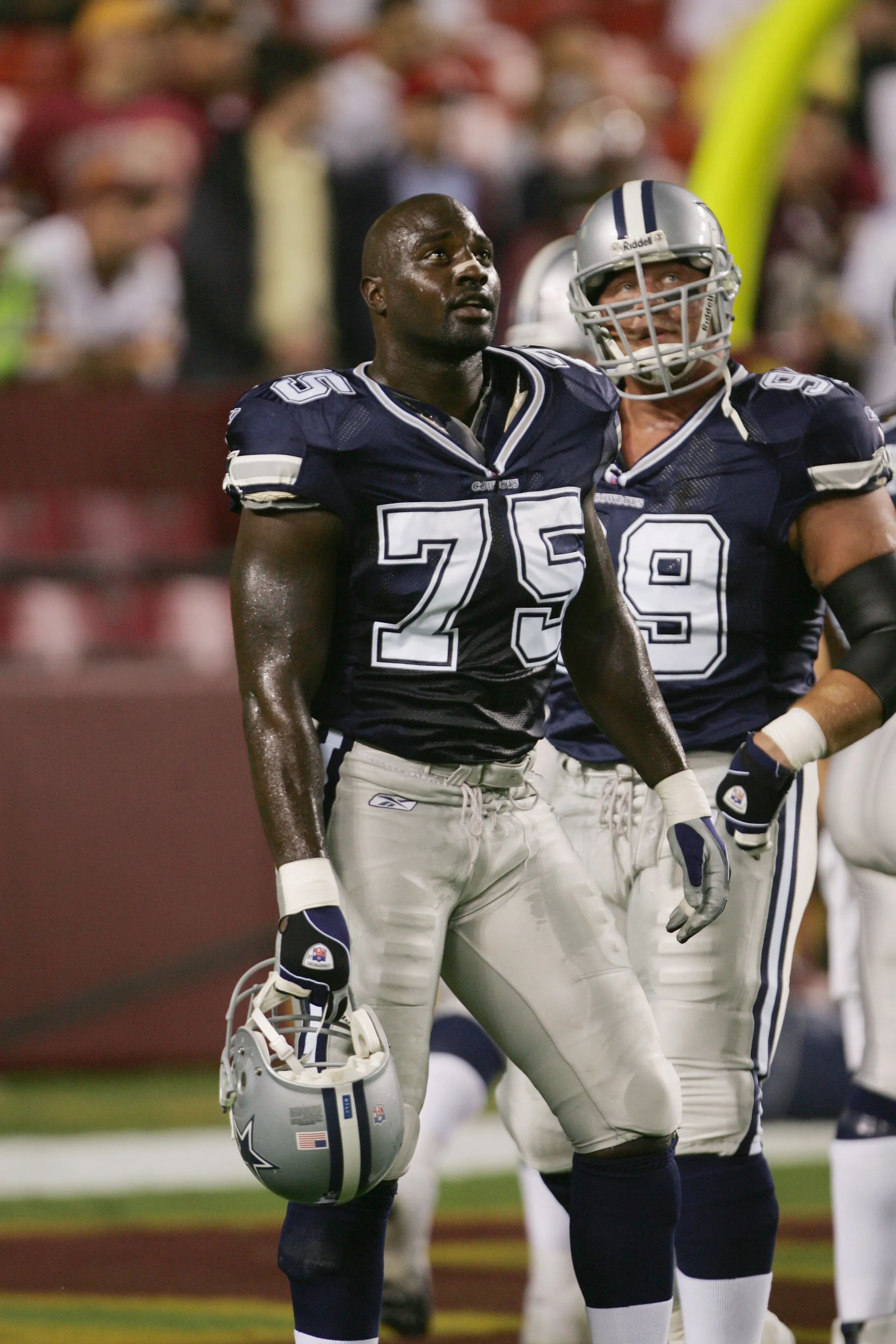 Defensive end Marcellus Wiley #75 of the Dallas Cowboys watching from the sideline.