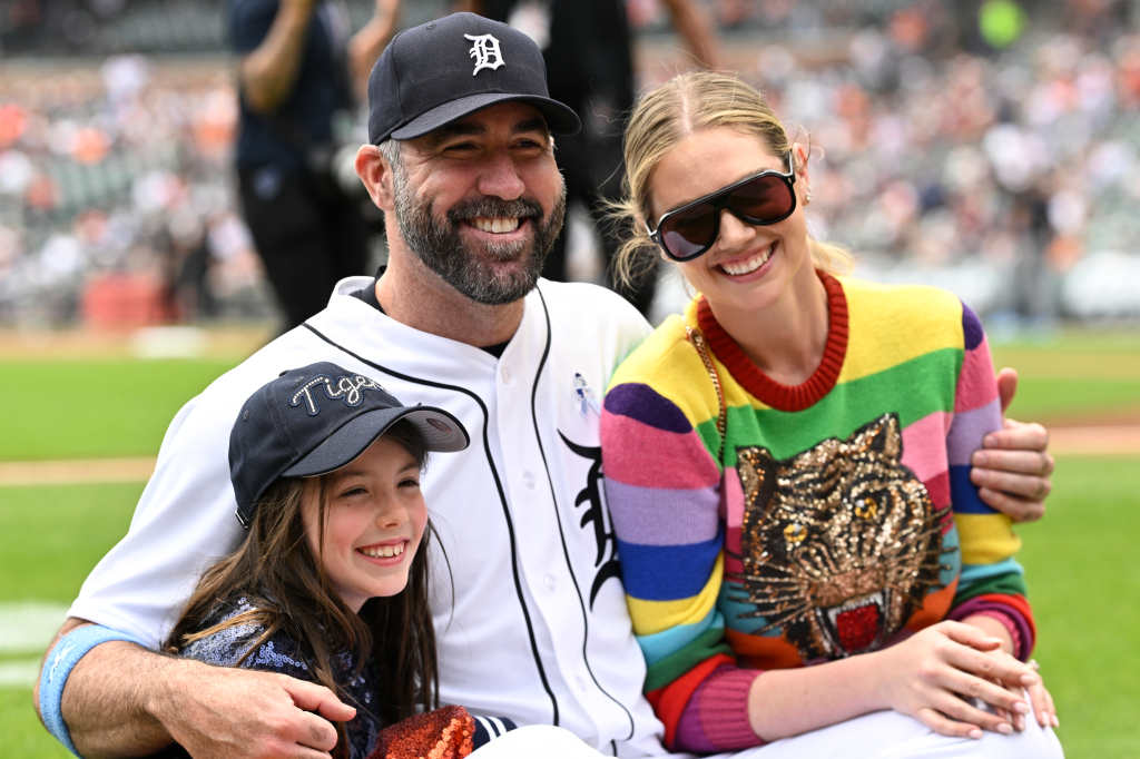 Detroit Tigers pitcher Justin Verlander with his wife, Kate Upton, and daughter on the field.
