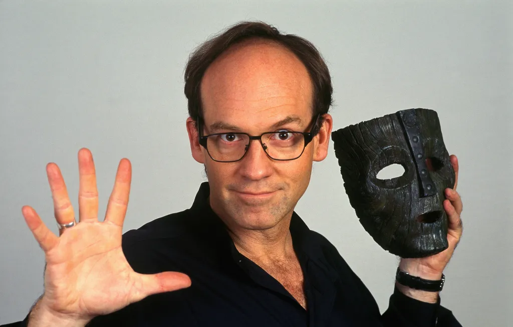 Director Chuck Russell posing with 