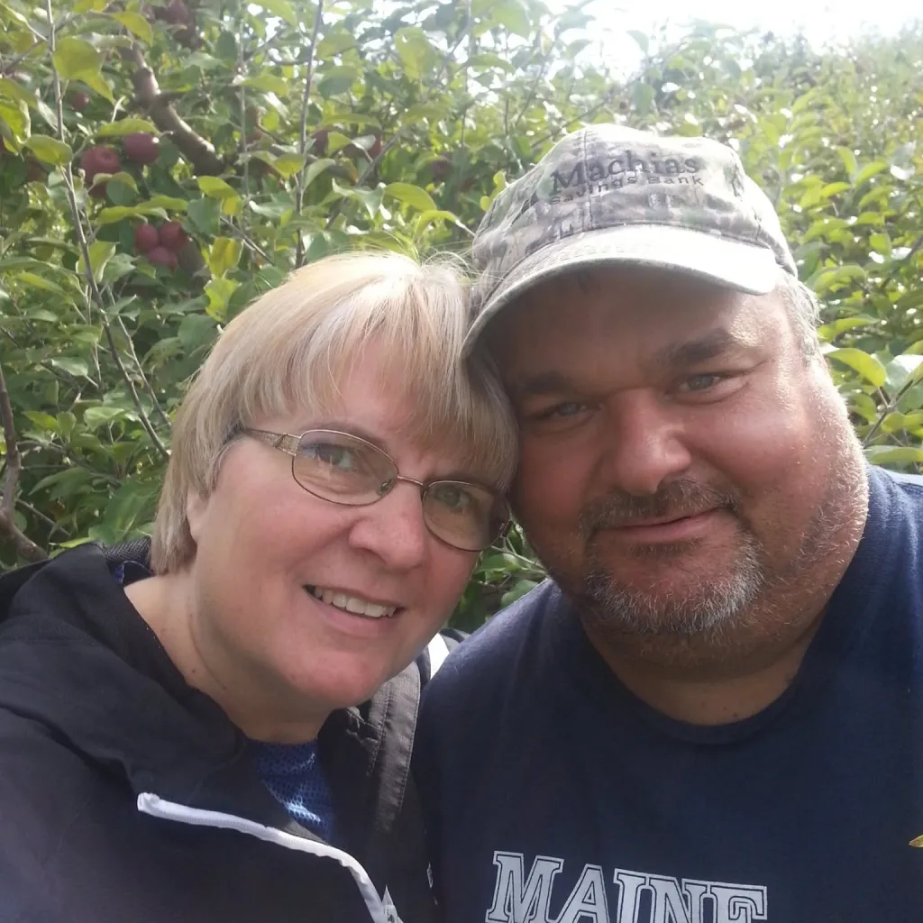 Elvia and Todd Malcolm posing for a photo.