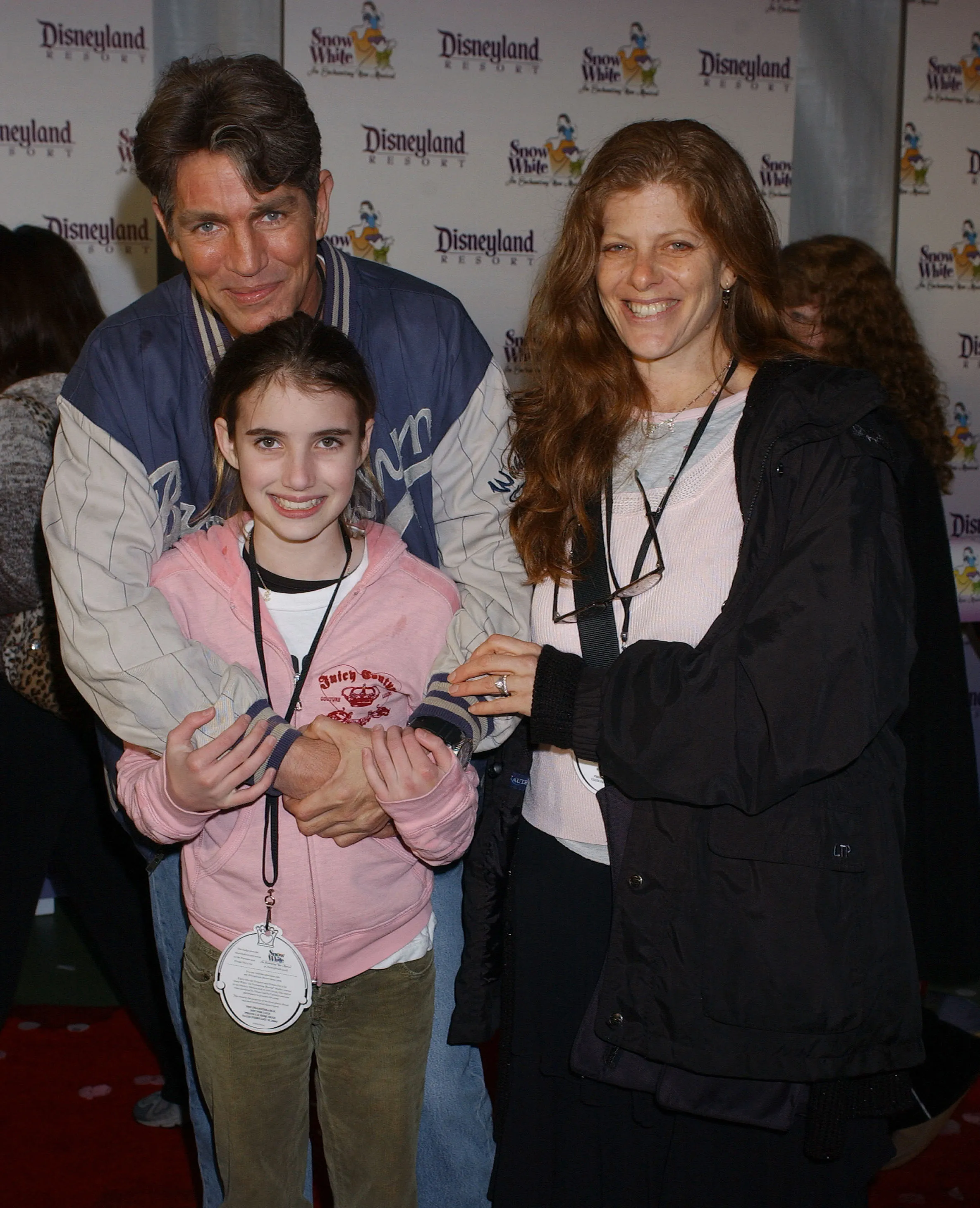 Eric Roberts, daughter Emma, and wife Eliza smiling at the premiere of 