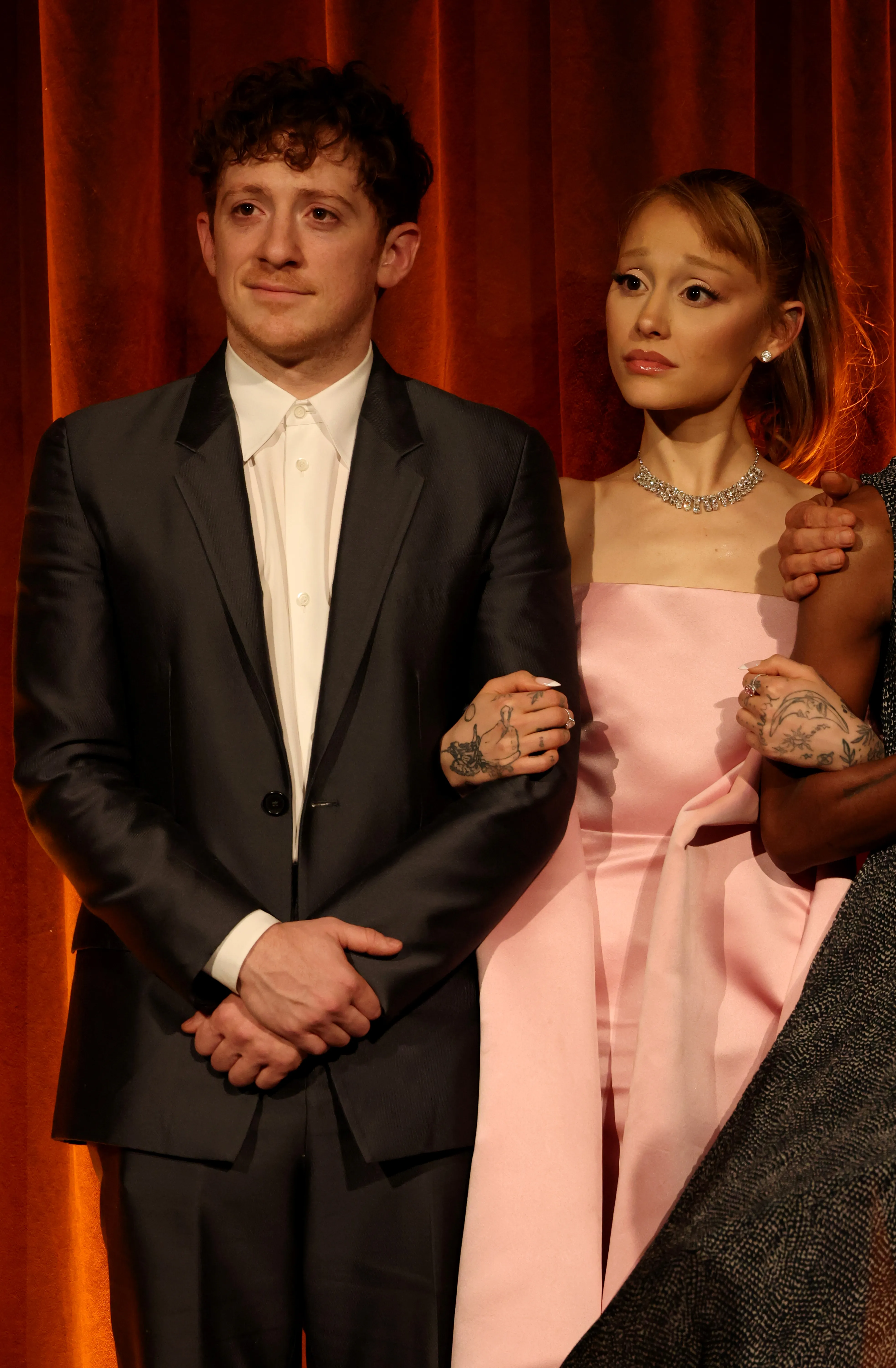 Ethan Slater and Ariana Grande accept the Best Film Award for 