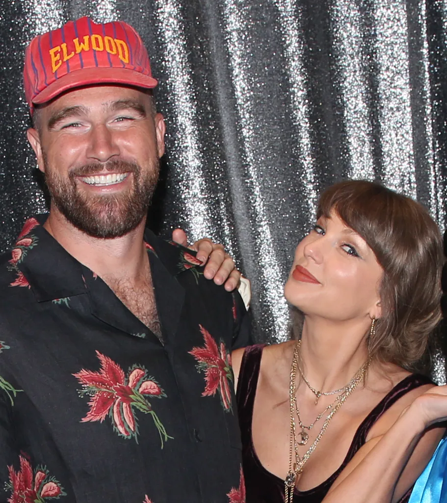 Travis Kelce and Taylor Swift posing backstage at 