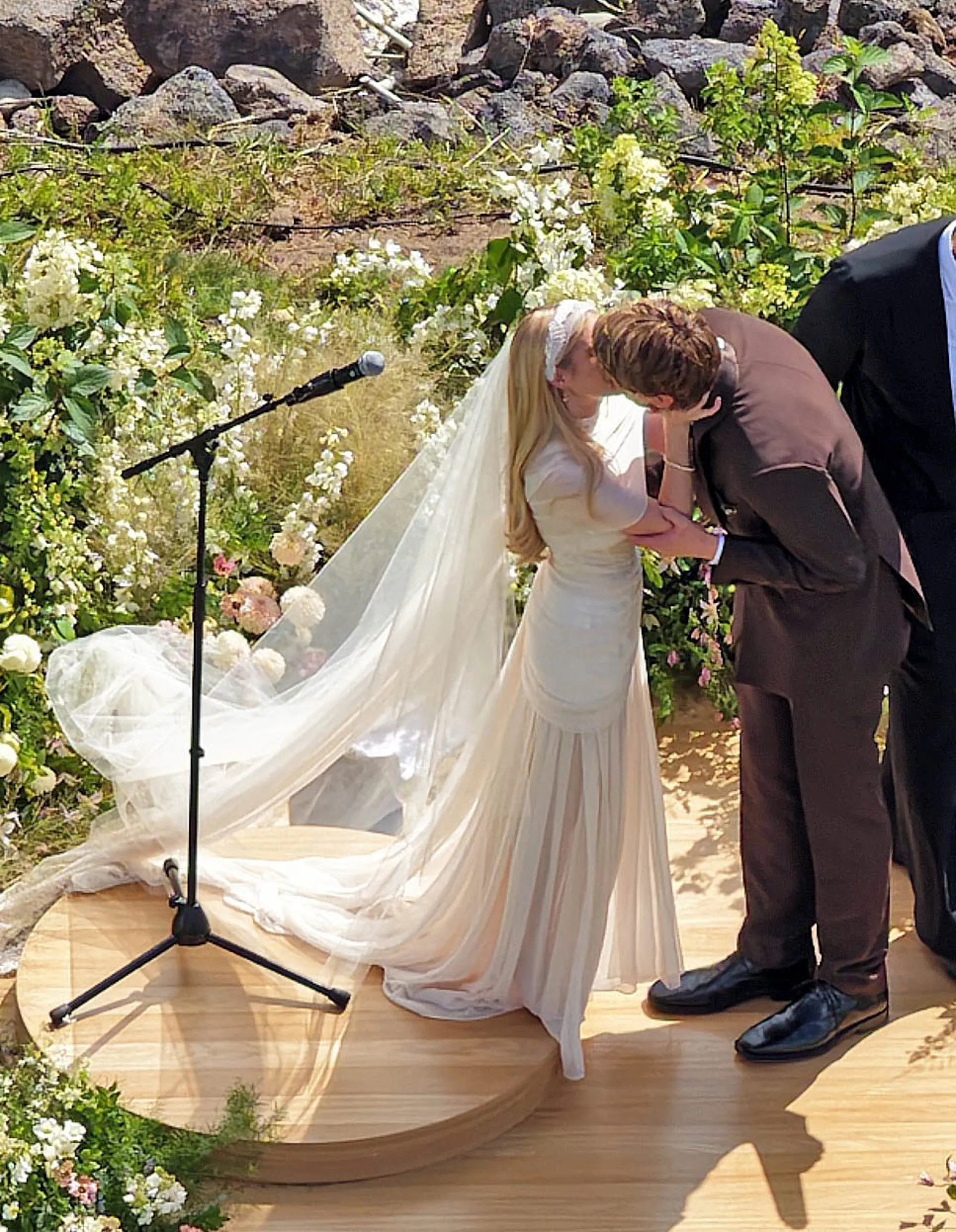 Emma Roberts and Cody John kiss at their wedding ceremony.