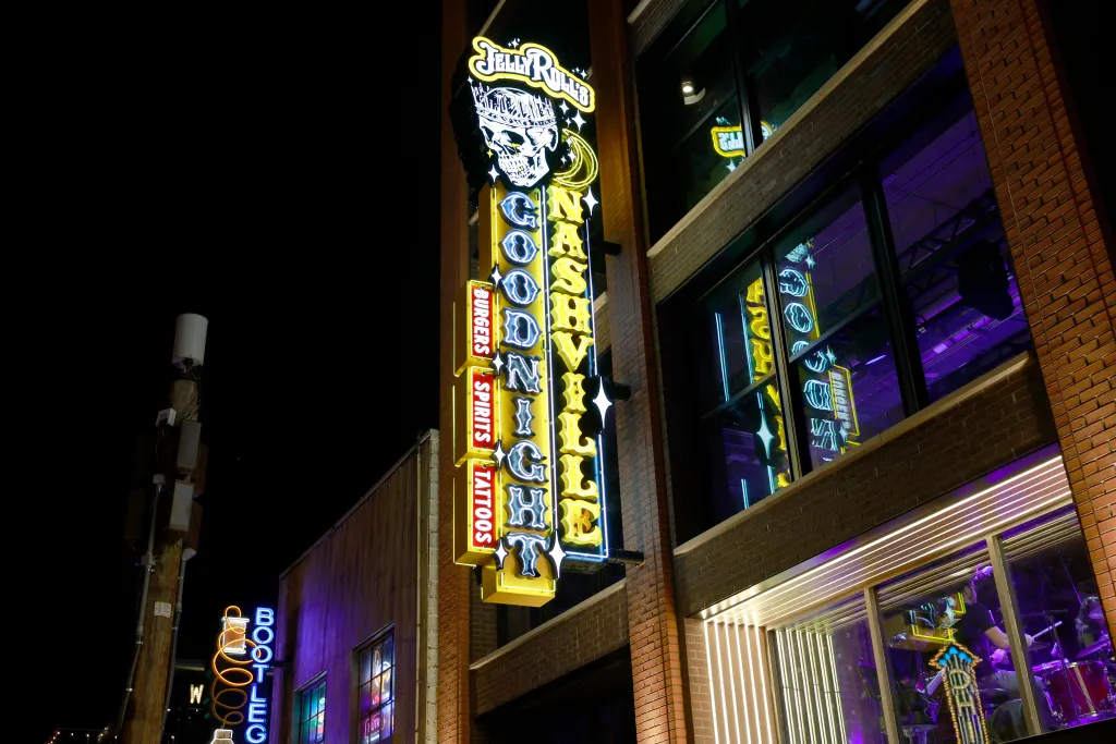 Exterior of Jelly Roll's Goodnight Nashville at night with a large neon sign.