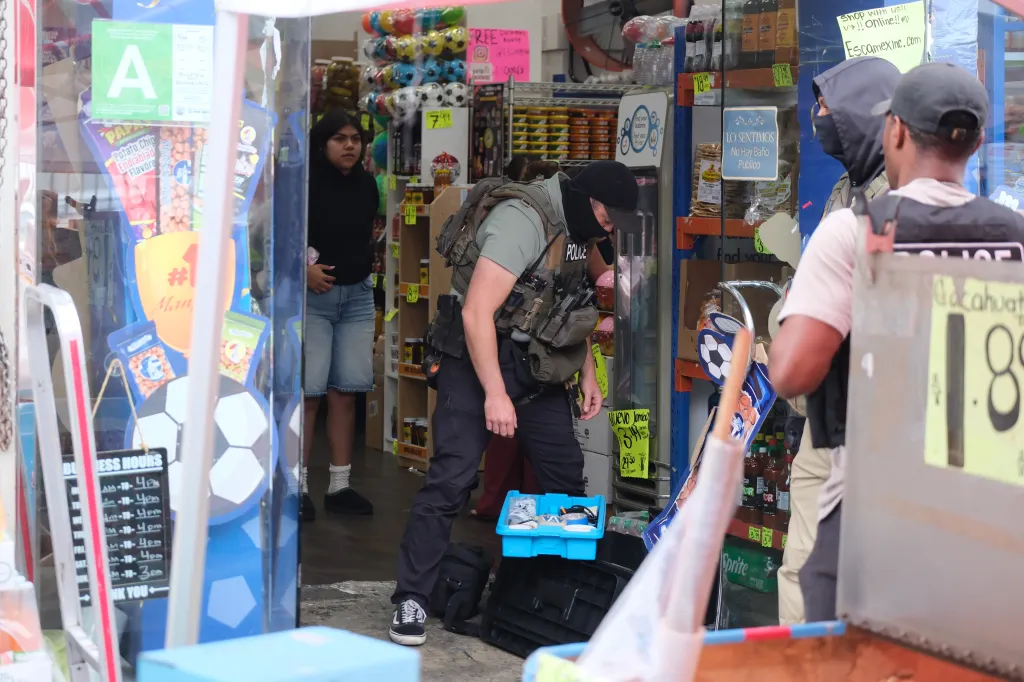 FBI agents execute a search warrant at a bodega.