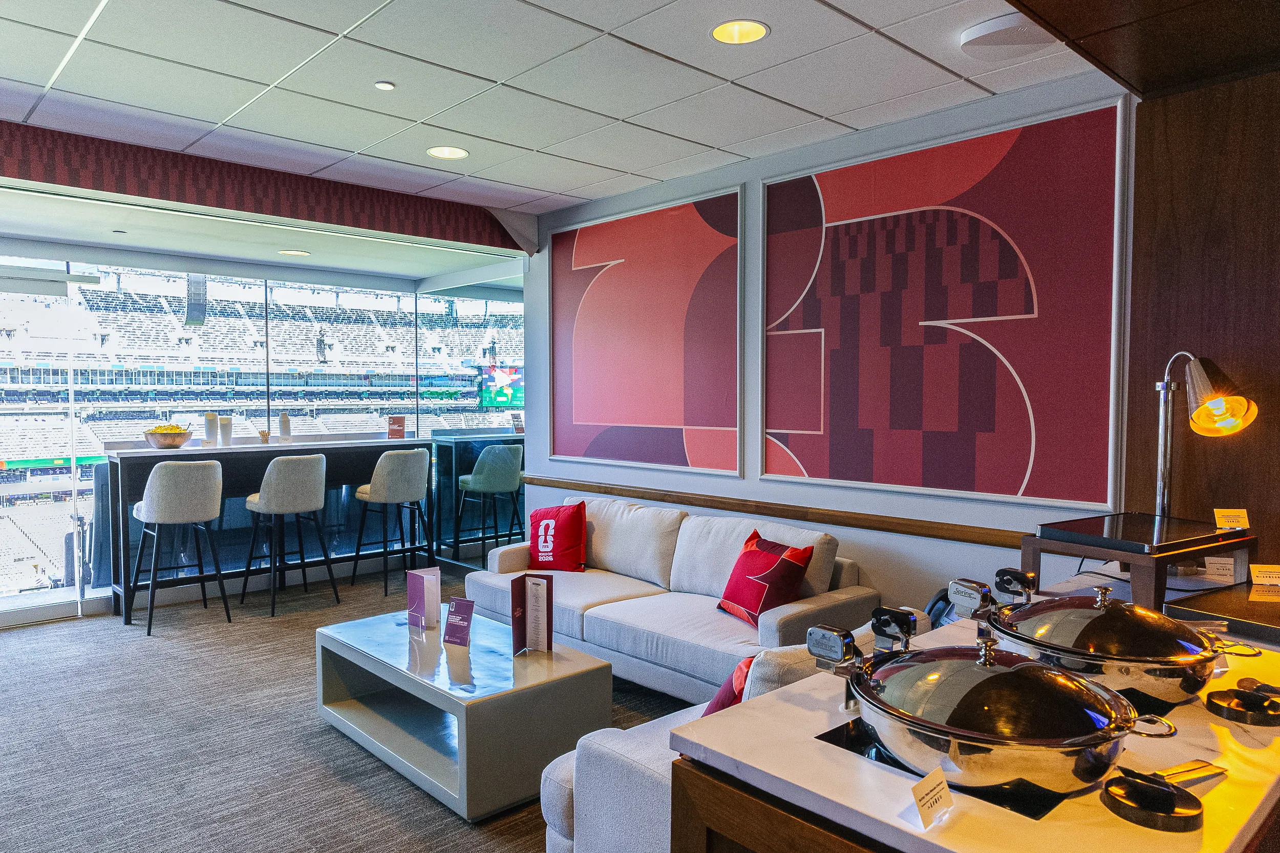 An empty FIFA World Cup 2026 suite with a stadium view.