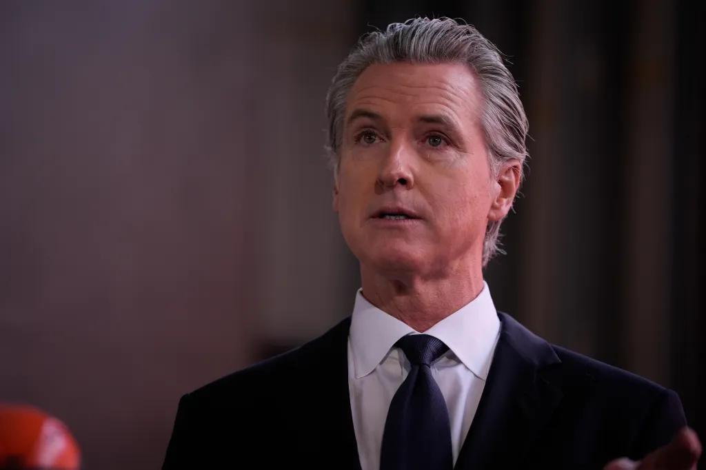 California Governor Gavin Newsom speaking at a press conference in Oakland.