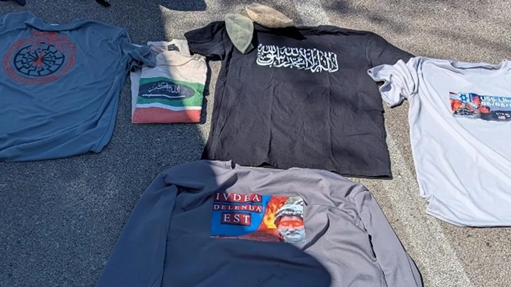 T-shirts with various symbols and text, including Arabic script, the phrase 