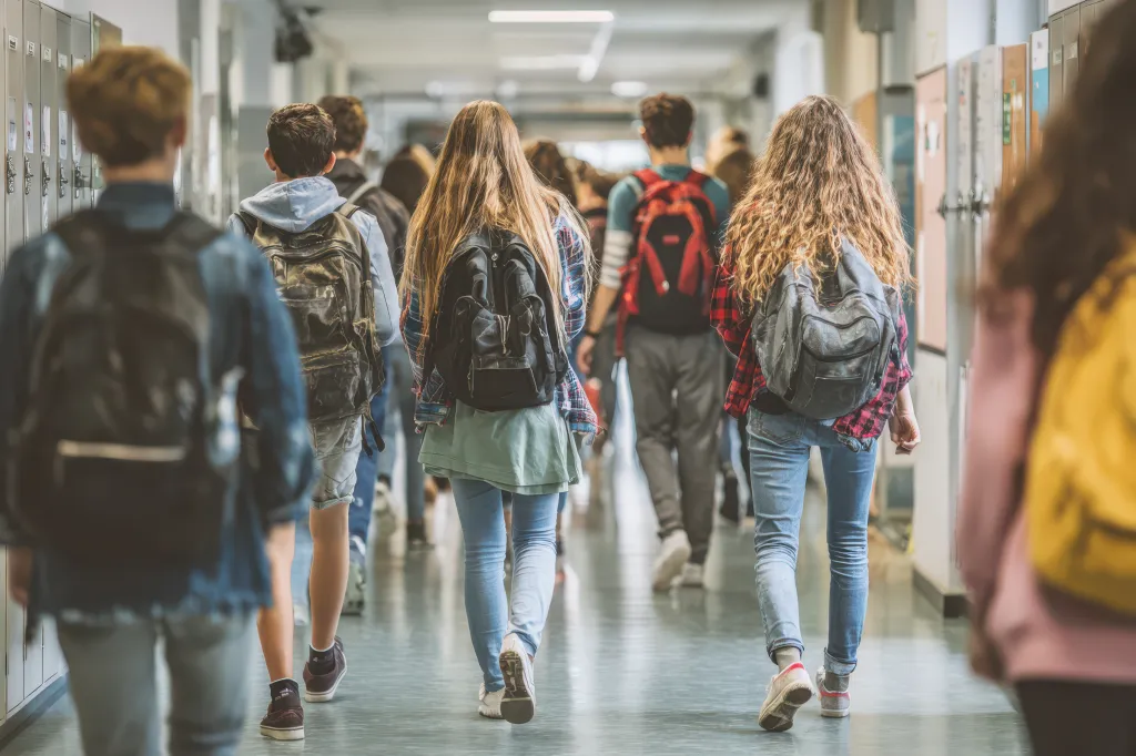 students walking in school hallway