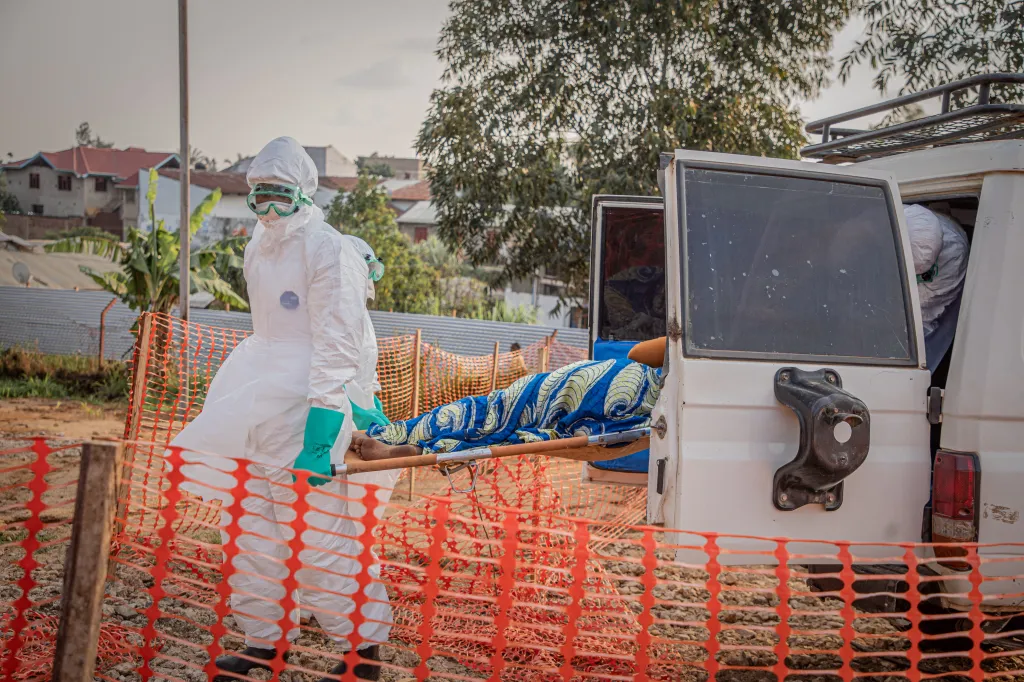 Healthcare workers carry on a stretcher a patient suffering from the Ebola virus disease from an ambulance at the Ebola Treatment Center (ETC) in Bunia, Ituri, in the east of the Democratic Republic of Congo on June 23, 2026.