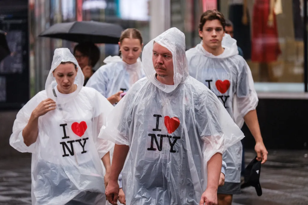 People wearing clear ponchos with