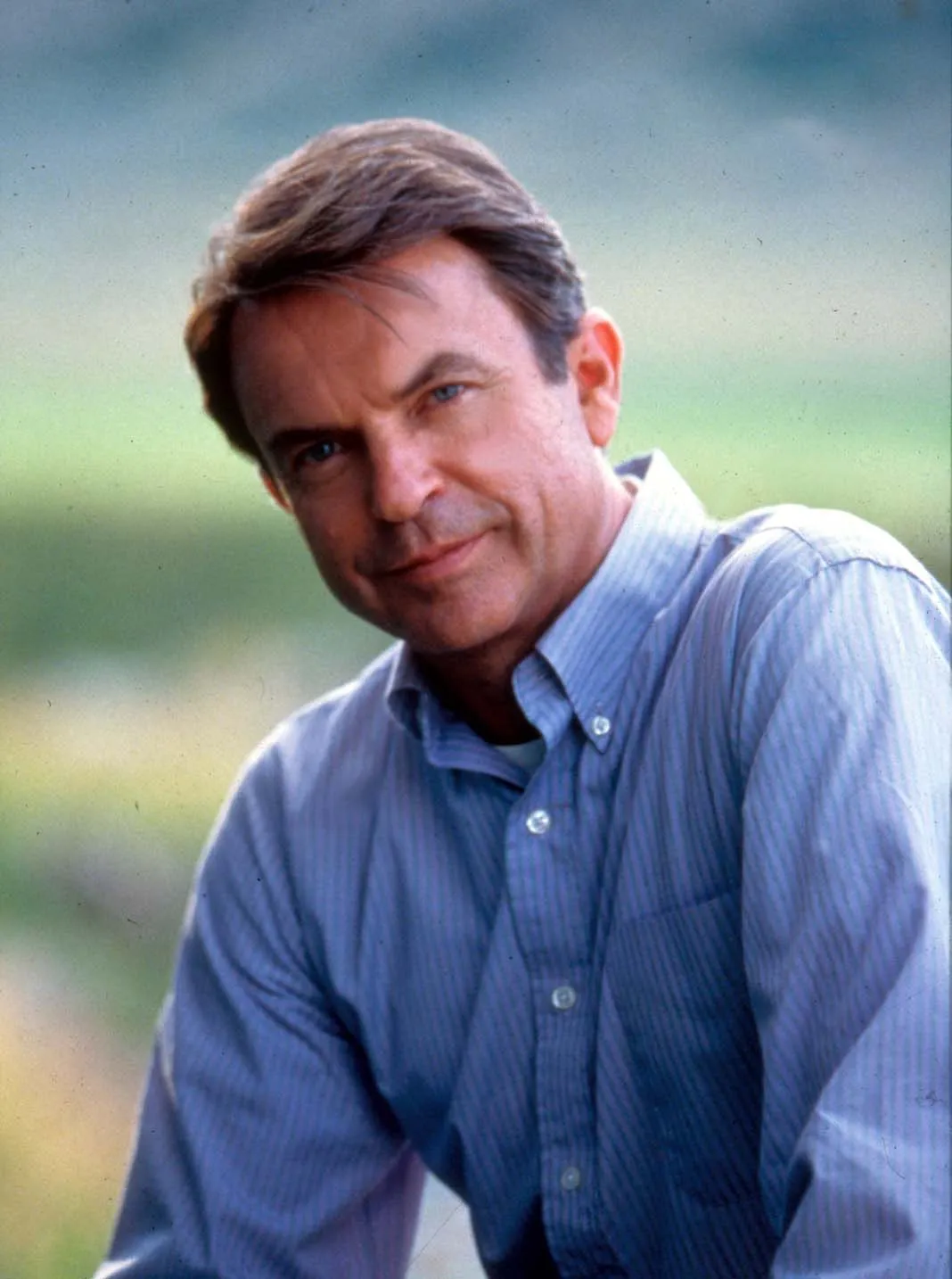 Sam Neill in a blue striped shirt from 