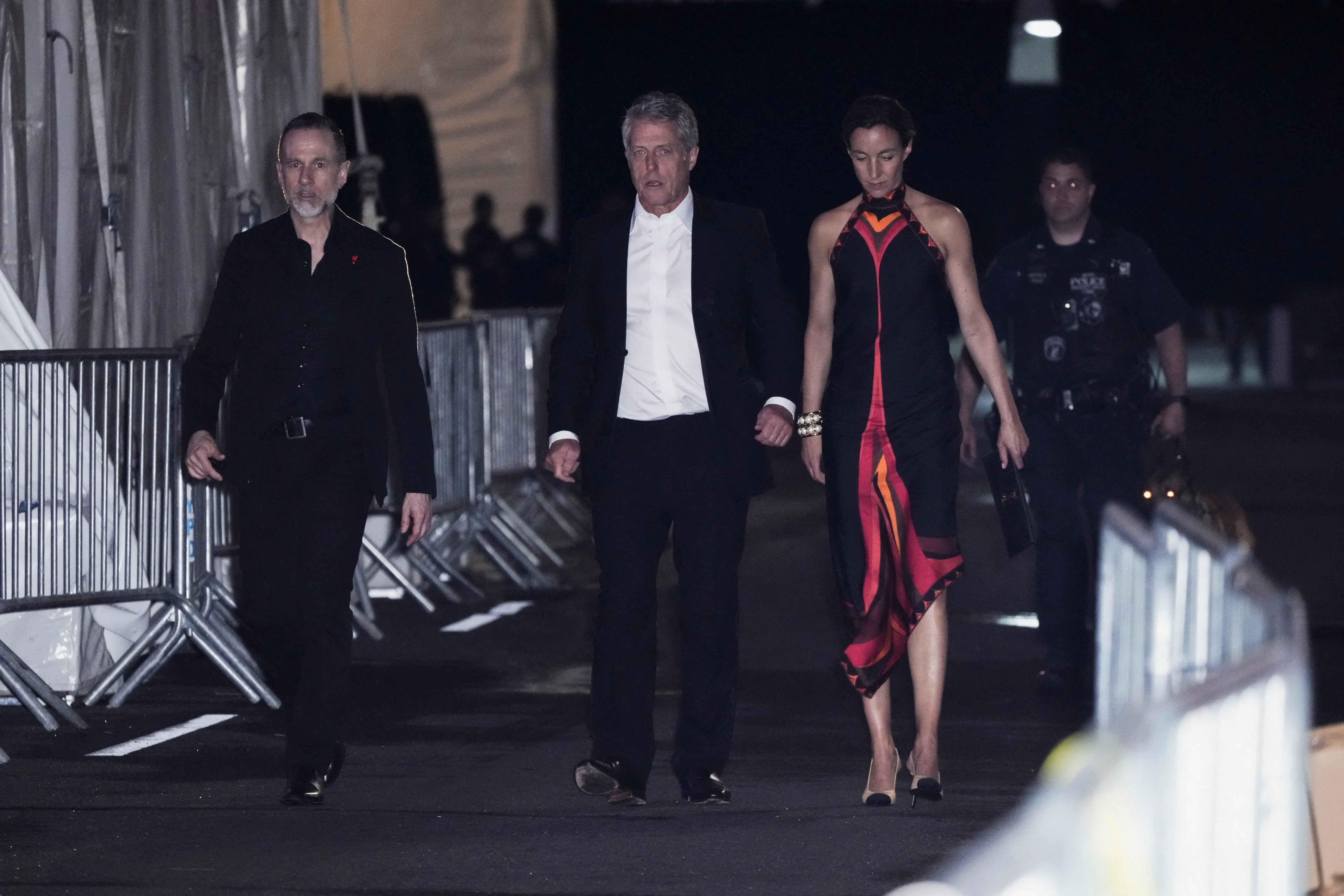 Hugh Grant and his wife, Anna Elisabet Eberstein, depart Madison Square Garden,