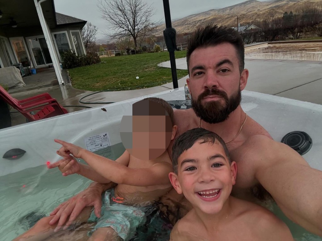 Austin Summers with his two sons in a hot tub.