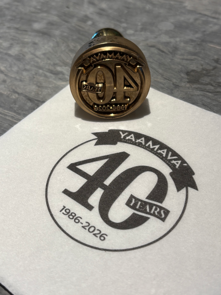 A close-up of a Yaamava' Resort & Casino 40th-anniversary stamp and logo.