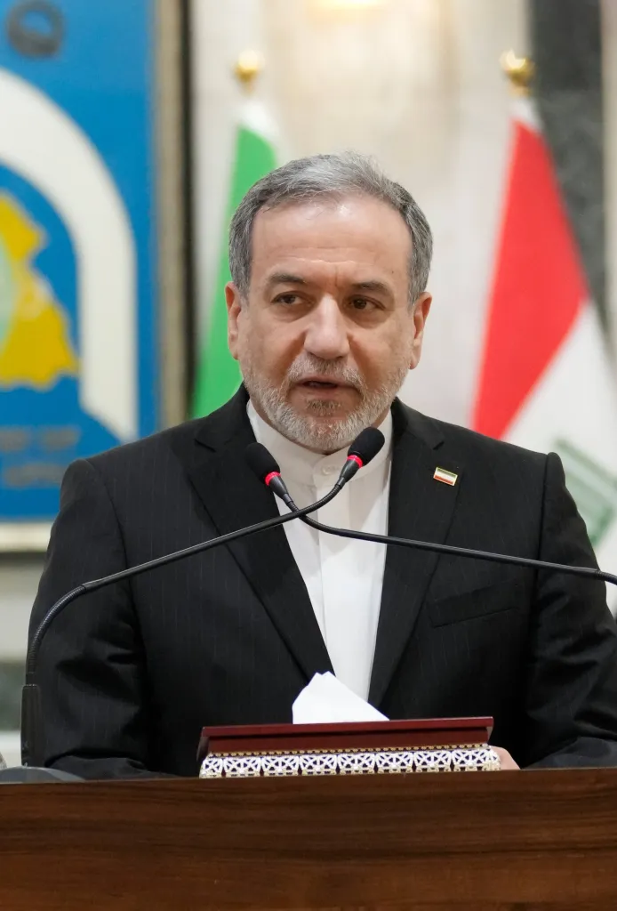Iranian Foreign Minister Abbas Araghchi speaking at a press conference.