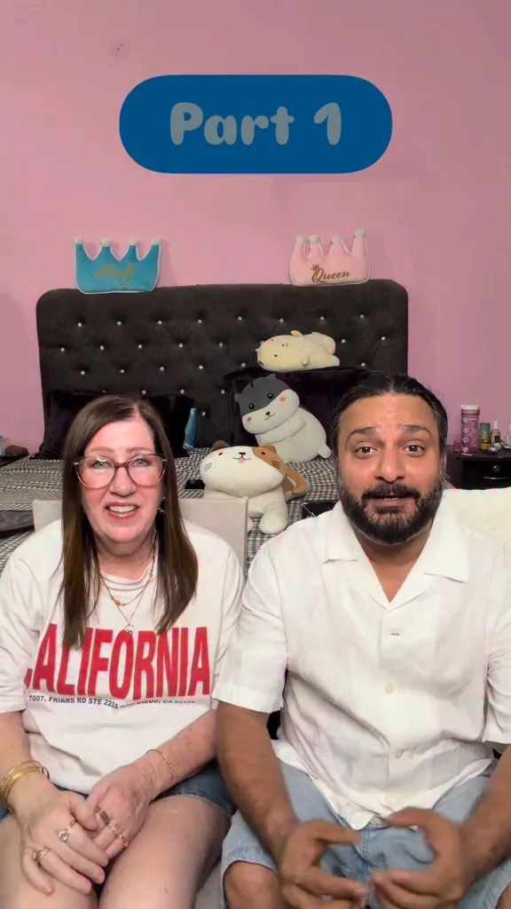 Jenny Slatten and Sumit Singh sitting on a bed and addressing the camera.