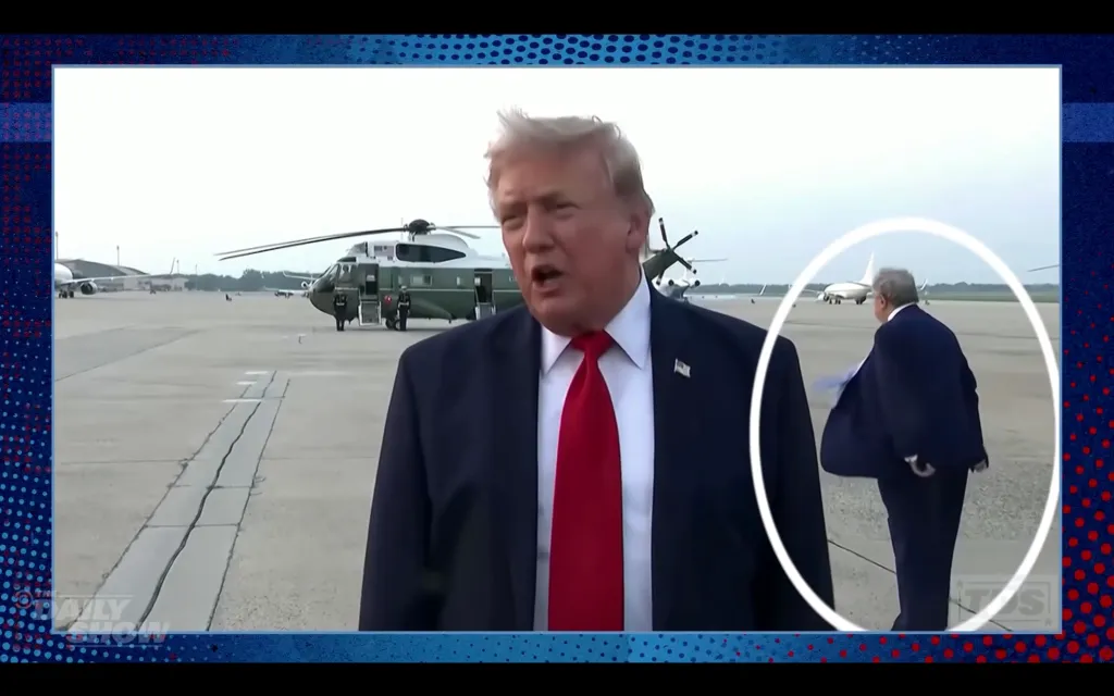 Donald Trump, wearing a suit and red tie, stands on an airfield, while another man who resembles him walks in the background, circled in white.