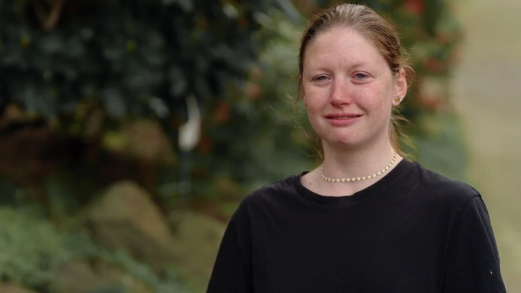 Catie looking slightly distressed and teary-eyed.