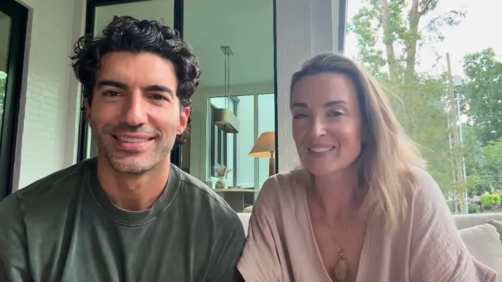 Justin Baldoni and a woman smiling.