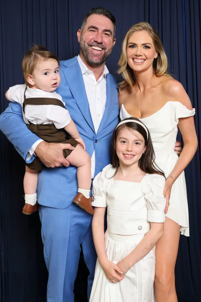Justin Verlander, Kate Upton, and their two children pose for a photo.
