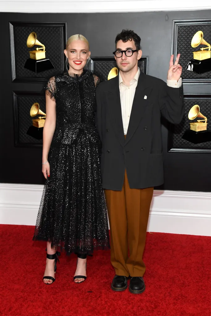 Carlotta Kohl and Jack Antonoff pose for a photo on the red carpet.