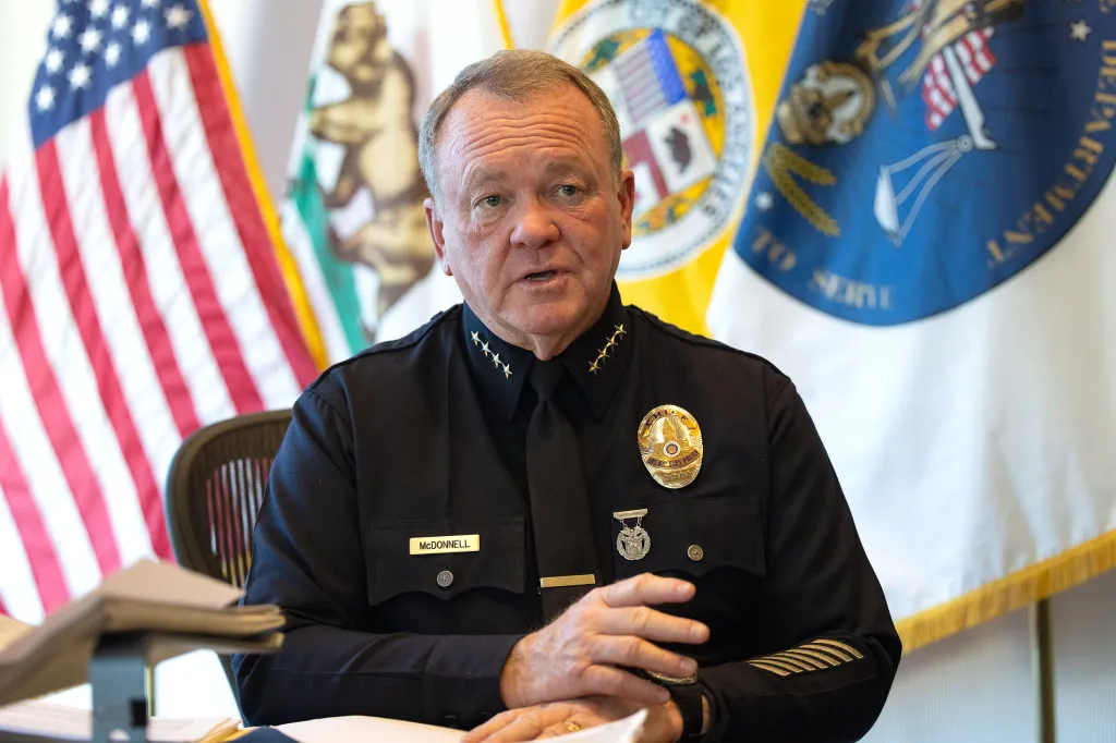 LAPD Chief Jim McDonnell speaking during an interview.