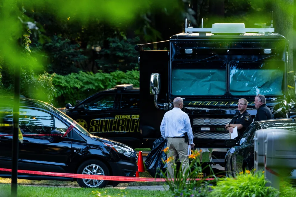 A truck and crime tape outside of the home.