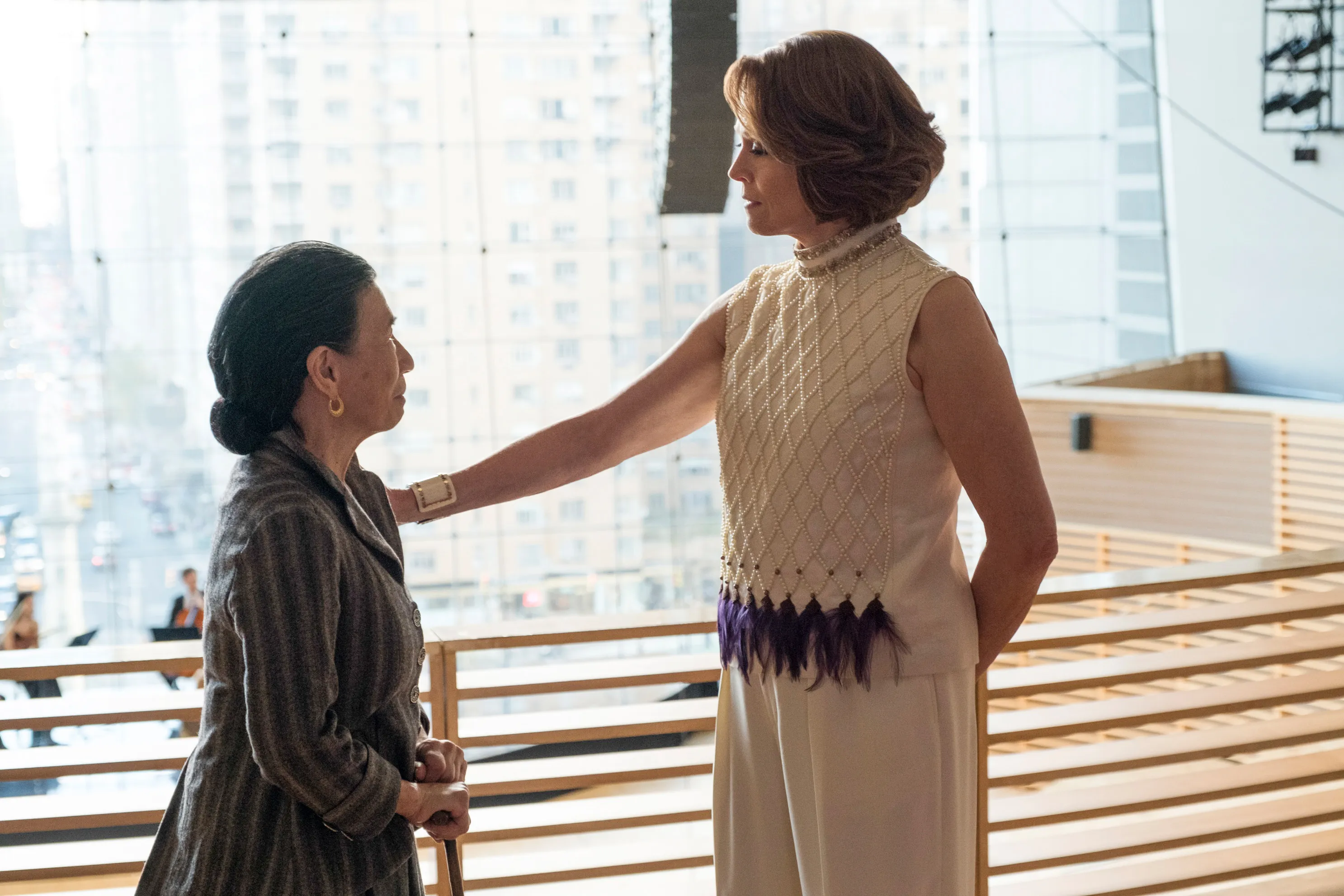 Sigourney Weaver places her hand on Wai Ching Ho's shoulder.
