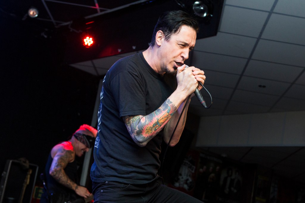 Lou Koller of Sick Of It All performing on stage.