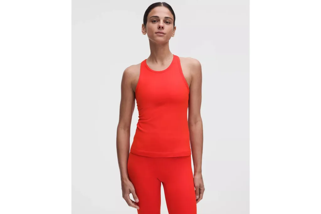 A woman wearing red leggings and a matching shirt